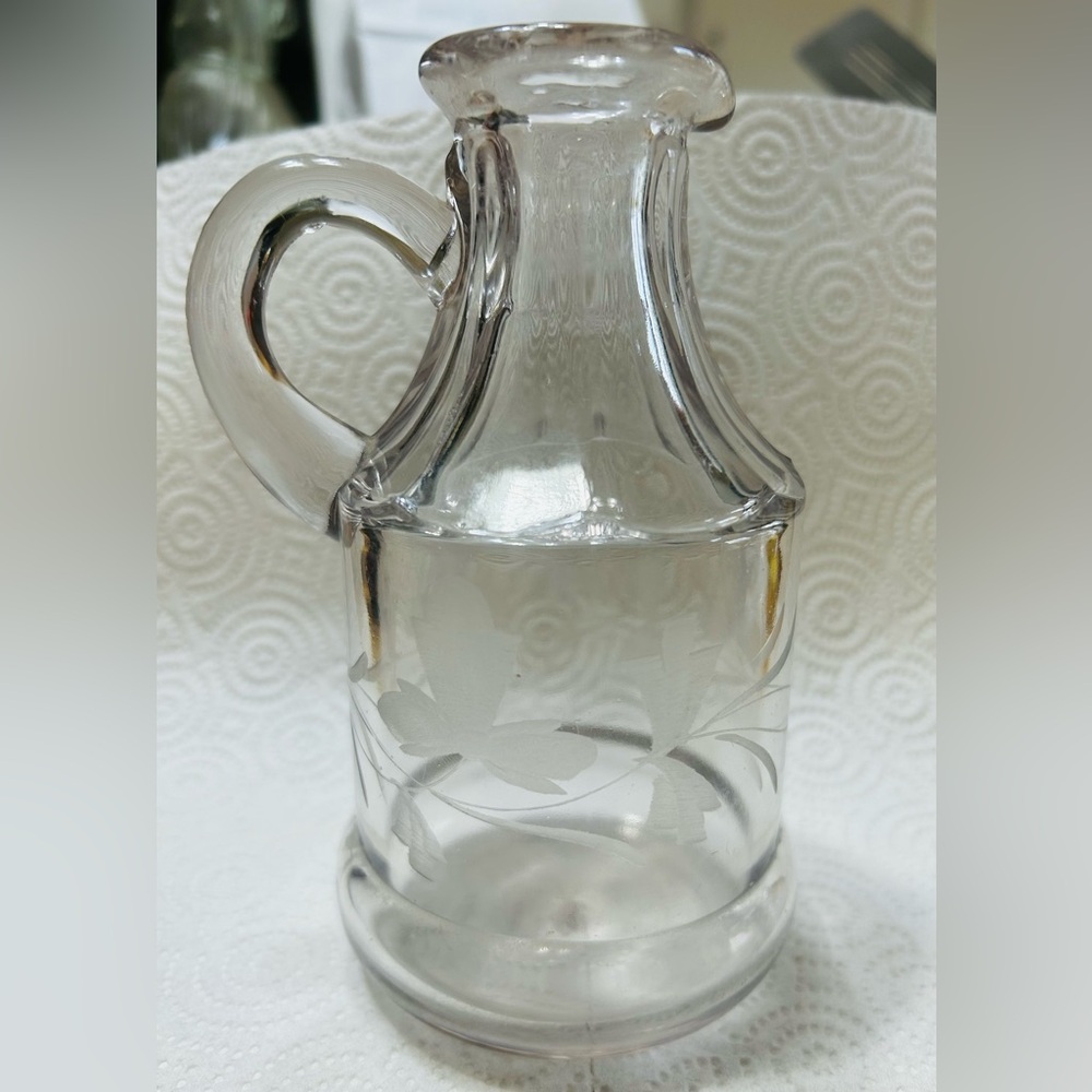 Vintage etched glass vinegar/syrup pitcher.  Excellent condition.